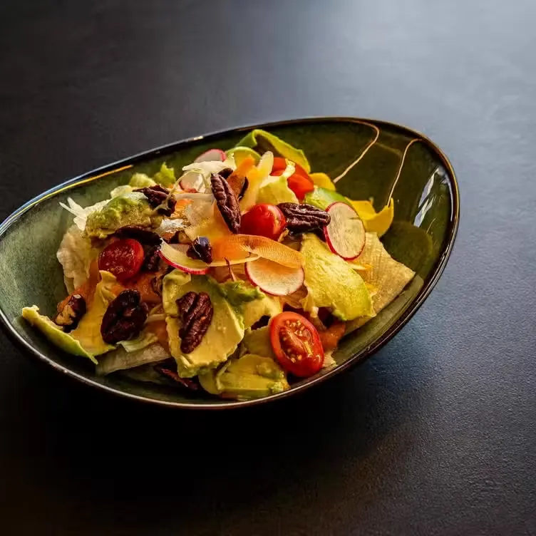 House salad with tomato, radish and citrus dressing