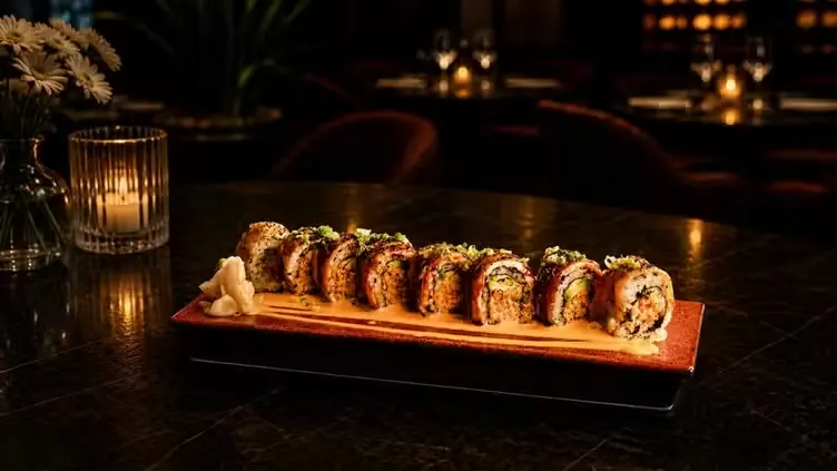 A signature roll served on a warm wooden board